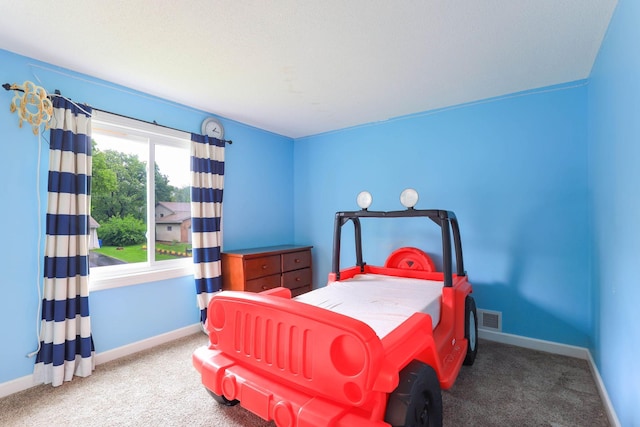 8317 Penn Ave N, Brooklyn Park, MN 55444 - carpeted bedroom with baseboards
