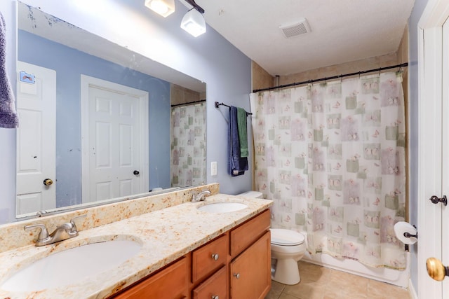 8317 Penn Ave N, Brooklyn Park, MN 55444 - bathroom featuring toilet, tile patterned flooring, and double vanity