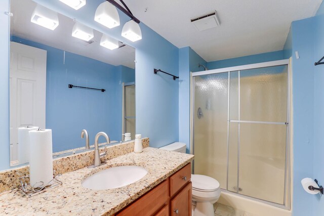 8317 Penn Ave N, Brooklyn Park, MN 55444 - bathroom with toilet, a stall shower, and vanity