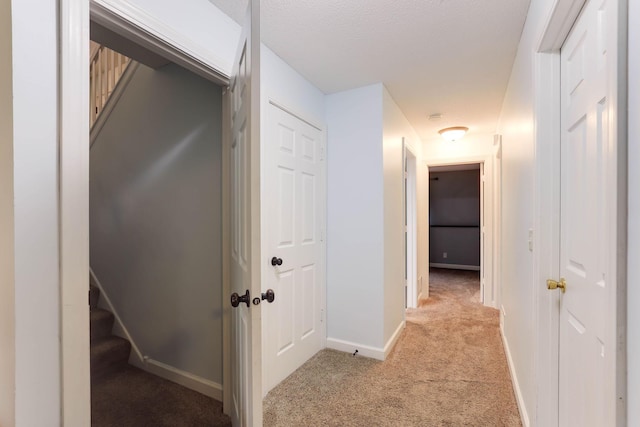 8317 Penn Ave N, Brooklyn Park, MN 55444 - hallway with light carpet, baseboards, and stairway