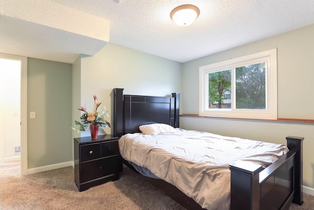 8317 Penn Ave N, Brooklyn Park, MN 55444 - carpeted bedroom featuring a textured ceiling and baseboards