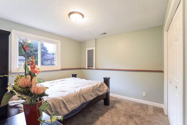 8317 Penn Ave N, Brooklyn Park, MN 55444 - carpeted bedroom featuring a textured ceiling and baseboards
