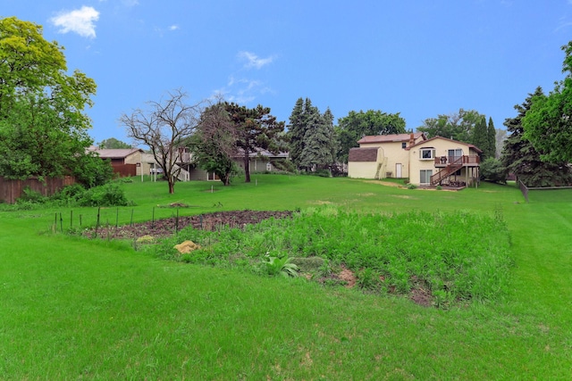 8317 Penn Ave N, Brooklyn Park, MN 55444 - view of yard with stairway and a wooden deck