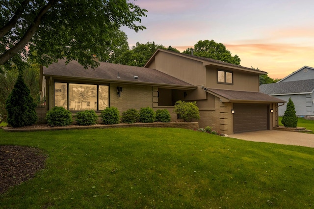 2367 Apache Ct, Mendota Heights, MN 55120 - mid-century modern home featuring brick siding, driveway, a front yard, and a garage