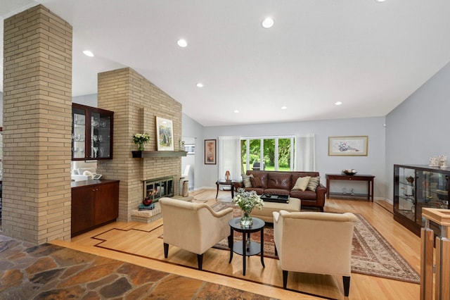 2367 Apache Ct, Mendota Heights, MN 55120 - living area with a fireplace, lofted ceiling, recessed lighting, and light wood-style flooring