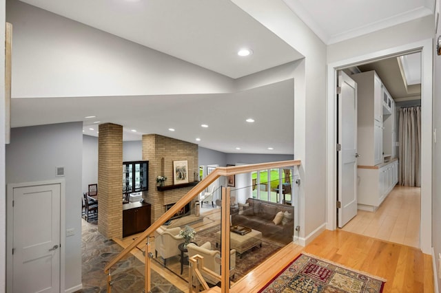 2367 Apache Ct, Mendota Heights, MN 55120 - stairway featuring lofted ceiling, recessed lighting, wood finished floors, and ornate columns