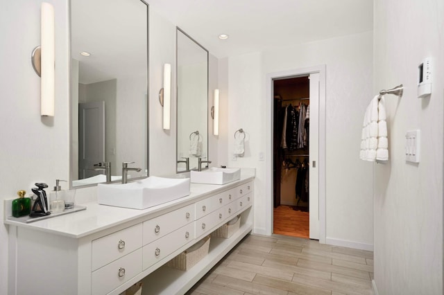 2367 Apache Ct, Mendota Heights, MN 55120 - full bath with double vanity, wood finished floors, and a spacious closet