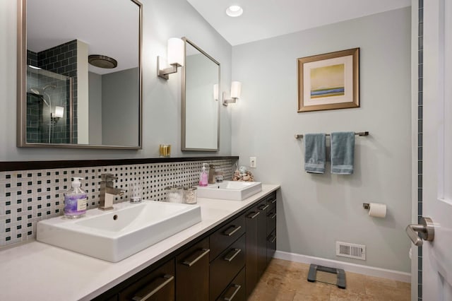 2367 Apache Ct, Mendota Heights, MN 55120 - full bath featuring double vanity, tasteful backsplash, and tiled shower
