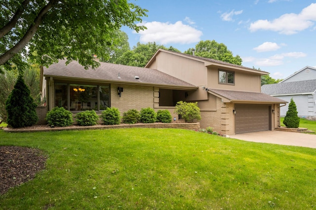 2367 Apache Ct, Mendota Heights, MN 55120 - view of front of house with brick siding, driveway, a front lawn, and an attached garage