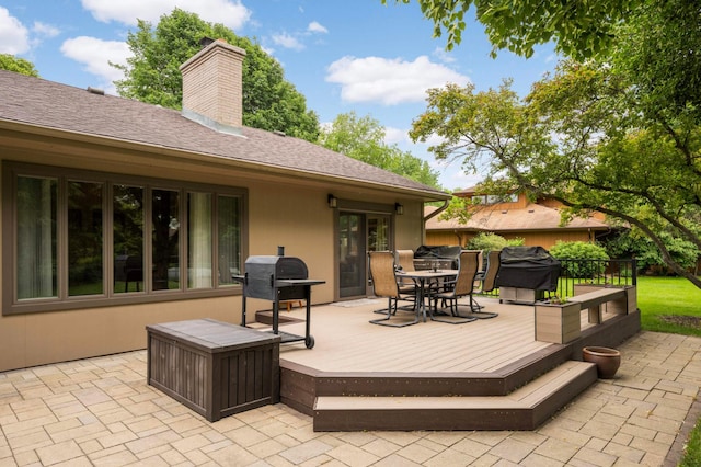 2367 Apache Ct, Mendota Heights, MN 55120 - wooden terrace with area for grilling, outdoor dining area, and a patio area