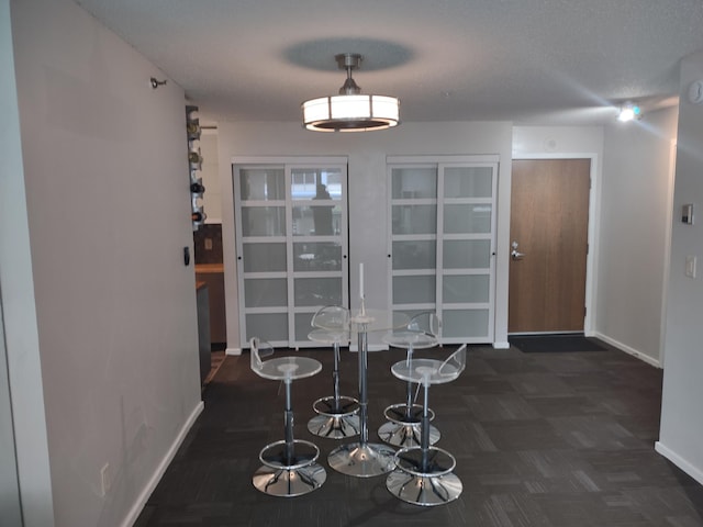 433 7th St Unit 1603, Minneapolis, MN 55415 - unfurnished dining area with baseboards and carpet