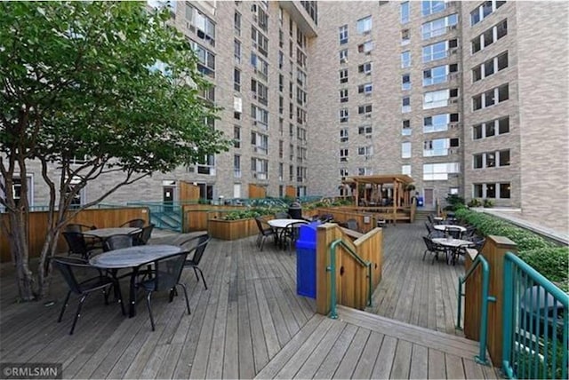 433 7th St Unit 1603, Minneapolis, MN 55415 - wooden terrace with outdoor dining space