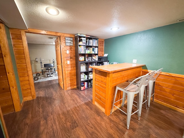 810 Division St, Elbow Lake, MN 56531 - home office featuring dark wood-style floors, a textured ceiling, and a textured wall