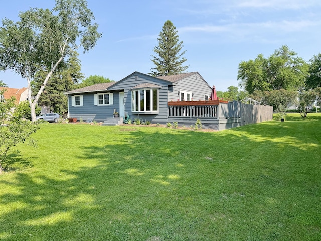 810 Division St, Elbow Lake, MN 56531 - back of property featuring a lawn and roof with shingles