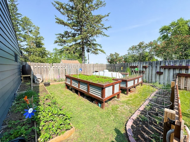 810 Division St, Elbow Lake, MN 56531 - fenced backyard featuring a garden and a deck