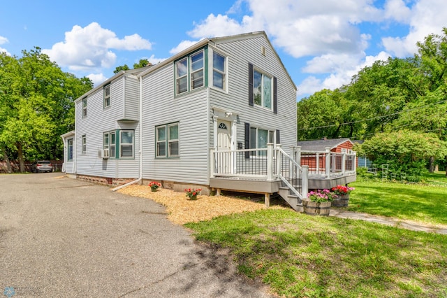 611 10th St S, Moorhead, MN 56560 - view of property exterior with a wooden deck and a yard