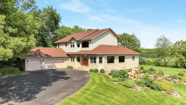 E5110 Interlachen Blvd, Pleasant Valley Twp, WI 54738 - view of front of home featuring asphalt driveway, a garage, and a front yard
