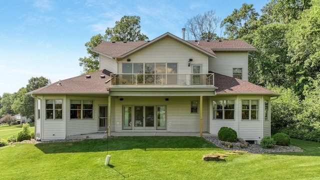 E5110 Interlachen Blvd, Pleasant Valley Twp, WI 54738 - back of property featuring a balcony, roof with shingles, a patio, and a yard