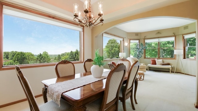 E5110 Interlachen Blvd, Pleasant Valley Twp, WI 54738 - dining area featuring arched walkways, a chandelier, plenty of natural light, and carpet