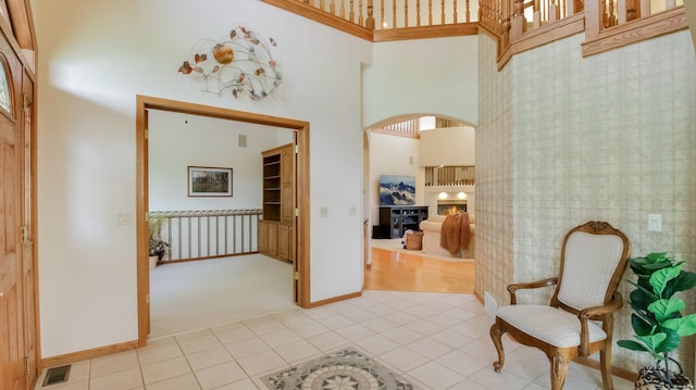 E5110 Interlachen Blvd, Pleasant Valley Twp, WI 54738 - entrance foyer with a high ceiling, light tile patterned floors, light carpet, baseboards, and arched walkways