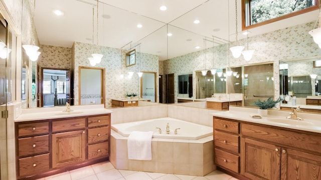 E5110 Interlachen Blvd, Pleasant Valley Twp, WI 54738 - bathroom with wallpapered walls, two vanities, a bath, tile patterned floors, and plenty of natural light