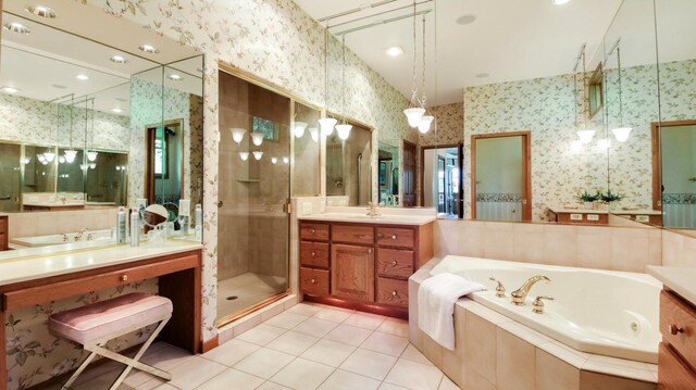 E5110 Interlachen Blvd, Pleasant Valley Twp, WI 54738 - bathroom with wallpapered walls, a tub with jets, tile patterned floors, vanity, and a stall shower