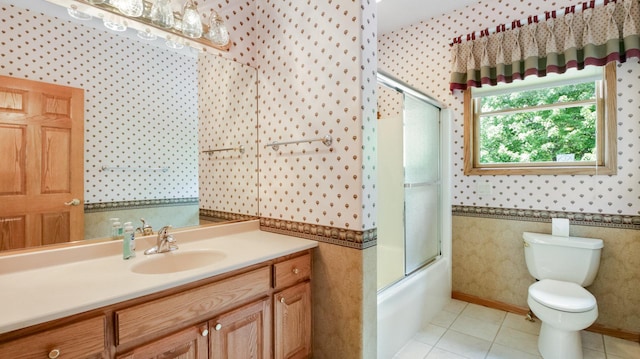 E5110 Interlachen Blvd, Pleasant Valley Twp, WI 54738 - full bath with wallpapered walls, vanity, toilet, combined bath / shower with glass door, and tile patterned floors
