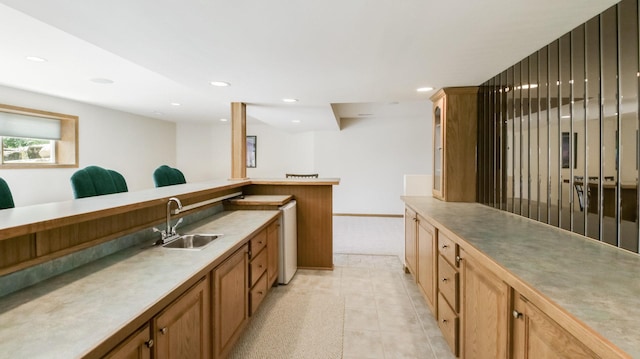 E5110 Interlachen Blvd, Pleasant Valley Twp, WI 54738 - kitchen featuring a sink, recessed lighting, and brown cabinetry