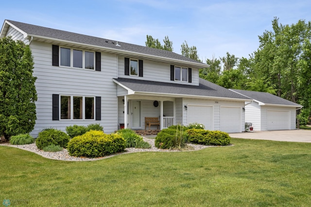 5701 33rd St S, Fargo, ND 58104 - traditional-style house with driveway, a garage, a front lawn, and a porch