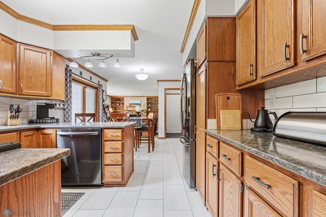 5701 33rd St S, Fargo, ND 58104 - kitchen with stainless steel appliances, brown cabinets, tasteful backsplash, ornamental molding, and light tile patterned floors