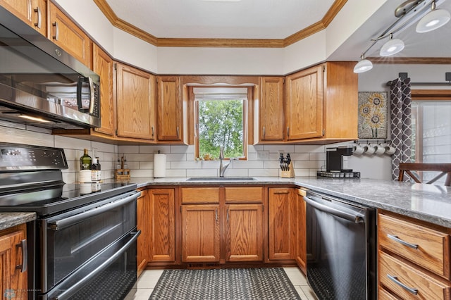 5701 33rd St S, Fargo, ND 58104 - kitchen featuring range with two ovens, dishwasher, a sink, crown molding, and light tile patterned floors