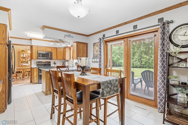 5701 33rd St S, Fargo, ND 58104 - dining space featuring crown molding and light tile patterned floors