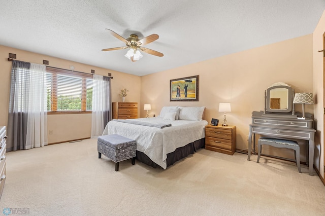 5701 33rd St S, Fargo, ND 58104 - carpeted bedroom featuring a ceiling fan, baseboards, and a textured ceiling