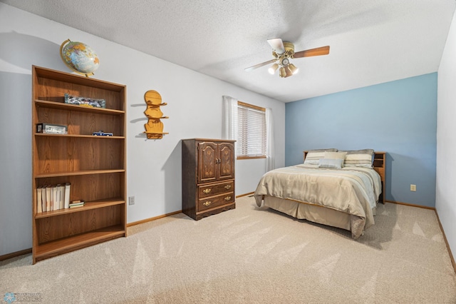 5701 33rd St S, Fargo, ND 58104 - carpeted bedroom with a textured ceiling, baseboards, and a ceiling fan