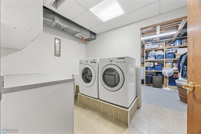 5701 33rd St S, Fargo, ND 58104 - washroom featuring washing machine and dryer and light tile patterned floors
