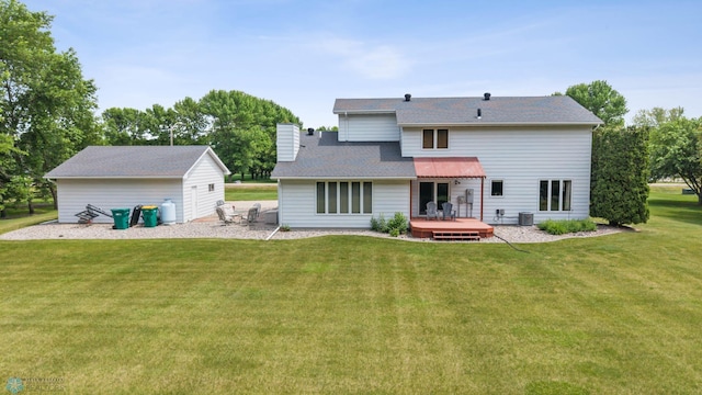 5701 33rd St S, Fargo, ND 58104 - rear view of house with a wooden deck, a lawn, a chimney, and central AC
