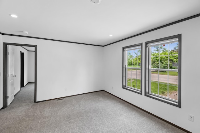 215 Mckay Ave # 42, Alexandria, MN 56308 - unfurnished room with ornamental molding, baseboards, carpet flooring, recessed lighting, and a smoke detector