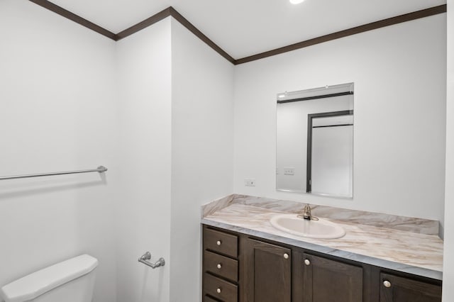 215 Mckay Ave # 42, Alexandria, MN 56308 - bathroom featuring crown molding, toilet, and vanity