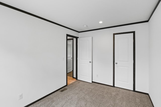 215 Mckay Ave # 42, Alexandria, MN 56308 - unfurnished bedroom with ornamental molding, carpet, baseboards, and recessed lighting