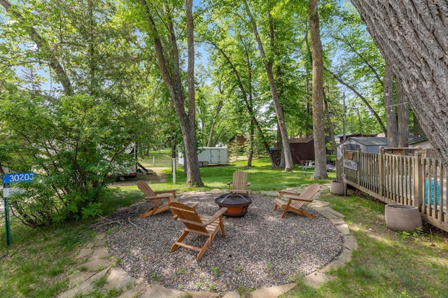 30203 Circle Dr, Breezy Point, MN 56472 - view of yard featuring an outdoor fire pit