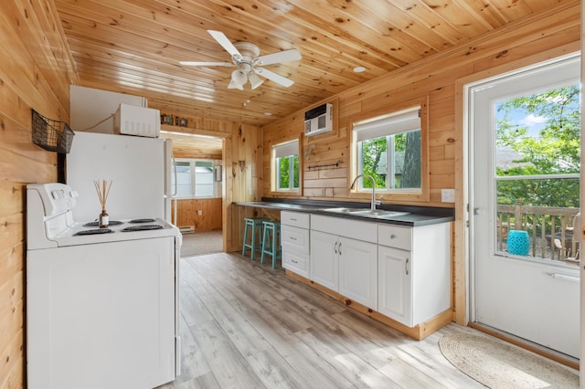 30203 Circle Dr, Breezy Point, MN 56472 - kitchen featuring white appliances, a sink, plenty of natural light, wooden walls, and wood ceiling