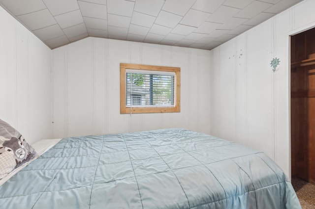 30203 Circle Dr, Breezy Point, MN 56472 - bedroom with a decorative wall, lofted ceiling, and carpet floors