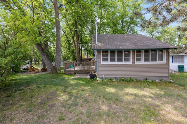 30203 Circle Dr, Breezy Point, MN 56472 - back of property with a deck, a yard, and roof with shingles