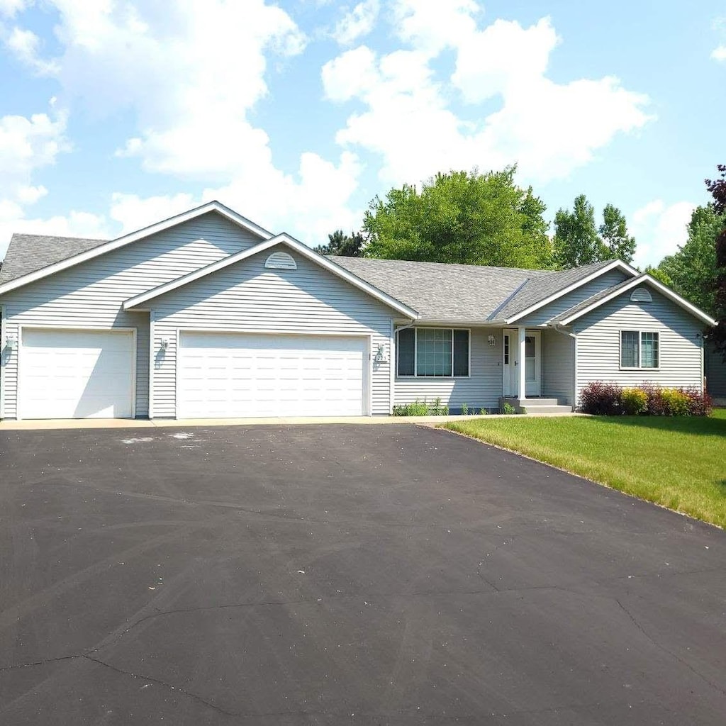225 85th St NW, Rice, MN 56367 - single story home with a garage, driveway, and a front lawn