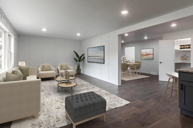 1020 1st St S, Cold Spring, MN 56320 - living area with dark wood-type flooring, recessed lighting, and a decorative wall
