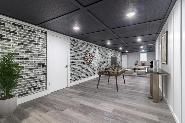 1020 1st St S, Cold Spring, MN 56320 - rec room featuring light wood-style flooring and brick wall