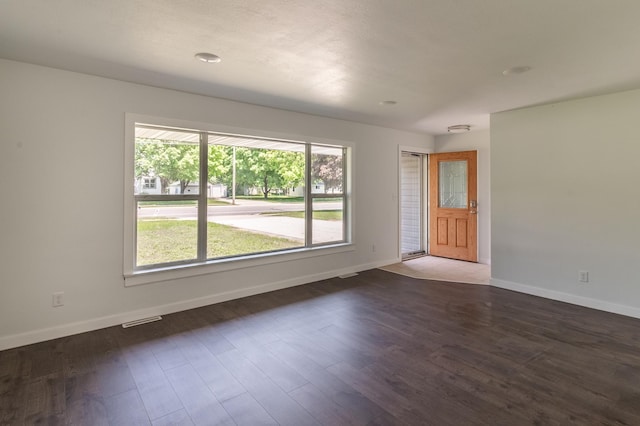 1020 1st St S, Cold Spring, MN 56320 - empty room featuring baseboards and dark wood finished floors