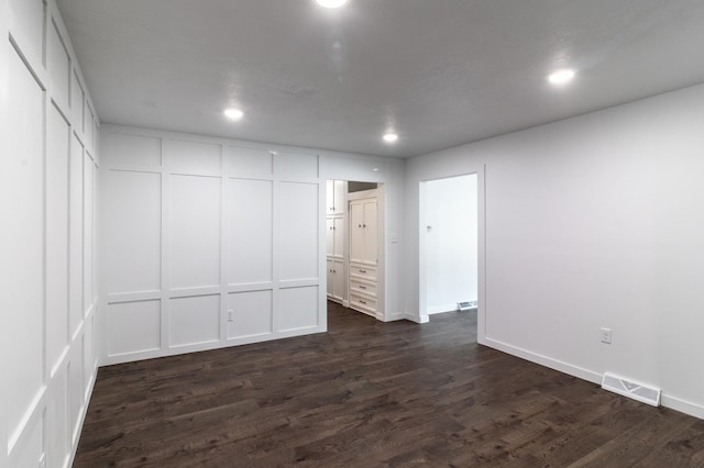 1020 1st St S, Cold Spring, MN 56320 - unfurnished bedroom with dark wood finished floors, recessed lighting, and baseboards