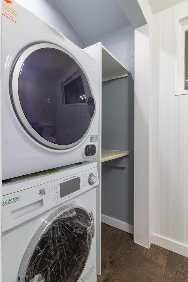 1020 1st St S, Cold Spring, MN 56320 - laundry area featuring stacked washer / dryer, dark wood-style flooring, and baseboards