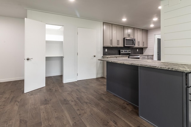 1020 1st St S, Cold Spring, MN 56320 - kitchen with appliances with stainless steel finishes, gray cabinetry, dark wood-type flooring, recessed lighting, and backsplash